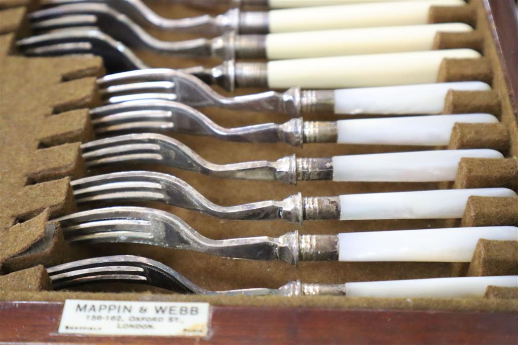 A Mappin & Webb part service of plated flatware in mahogany table canteen